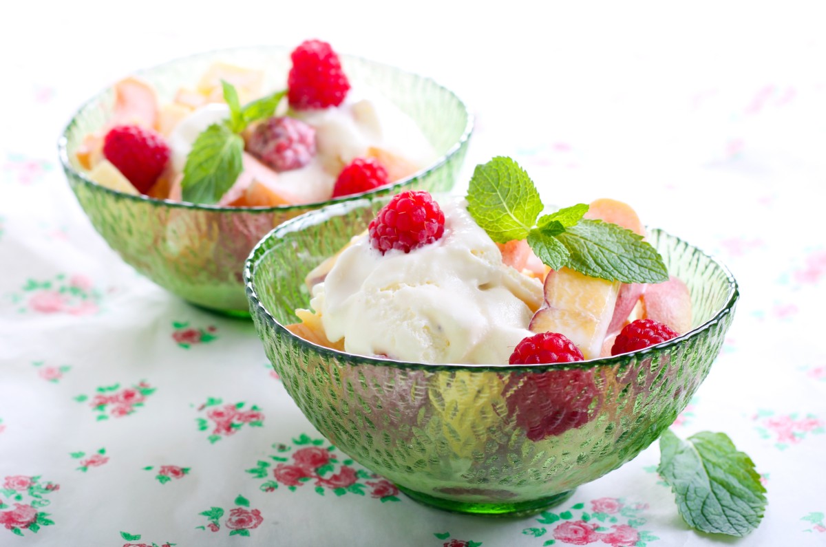 Fresh fruits, berry and ice cream dessert in bowl