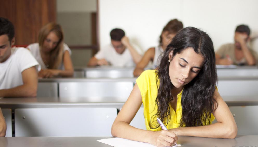 5girl writing in classroom